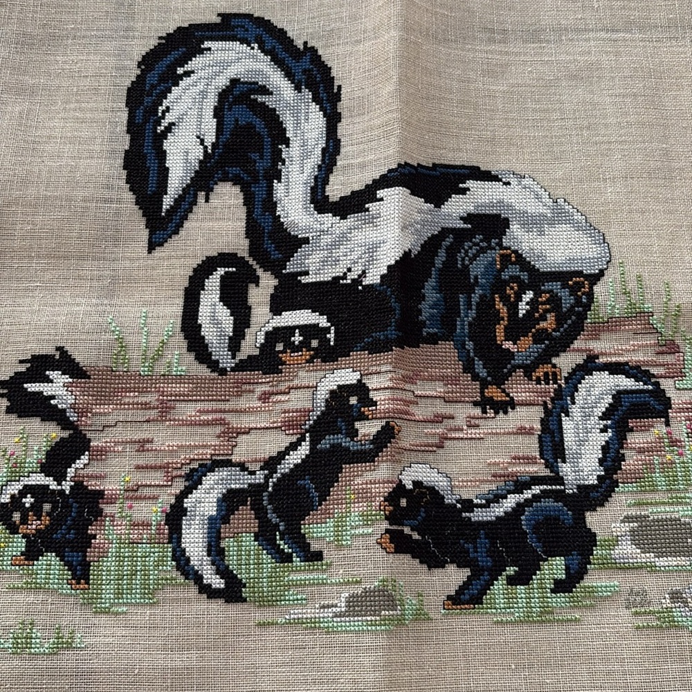 Handmade Needlepoint pictures of a skunk family